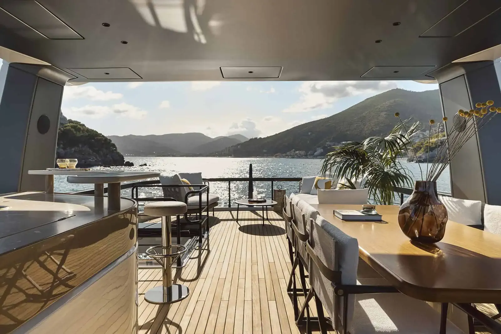 Flybridge terrace with outdoor lounge aboard Aqualis