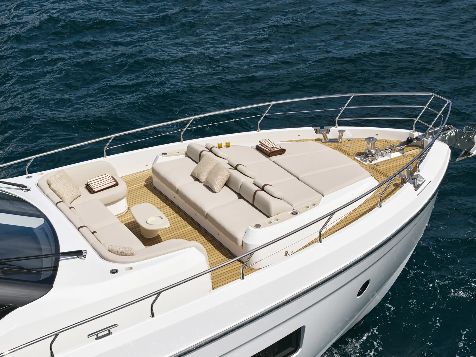 Bow sun lounge with carbon-fibre shade poles aboard Aqualis